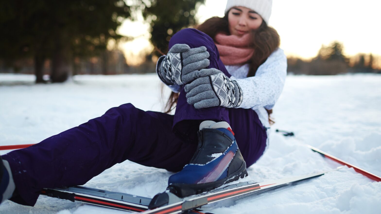 Woman who has hurt her leg skiing